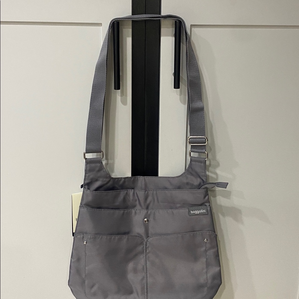 Baggallini Charcoal Crossbody Bag
Light blue interior lining. Front features